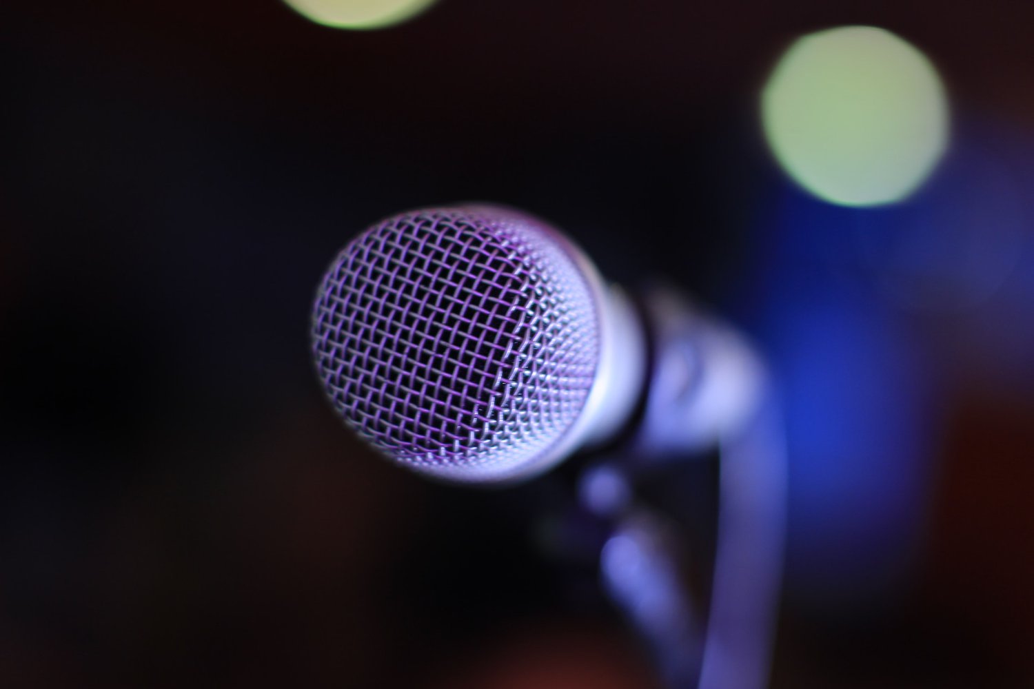 A microphone against a dark background