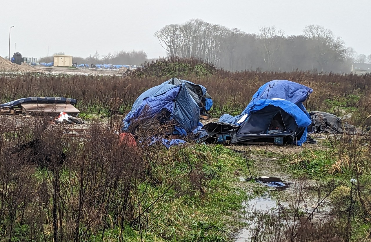 Broken tents on wasteland